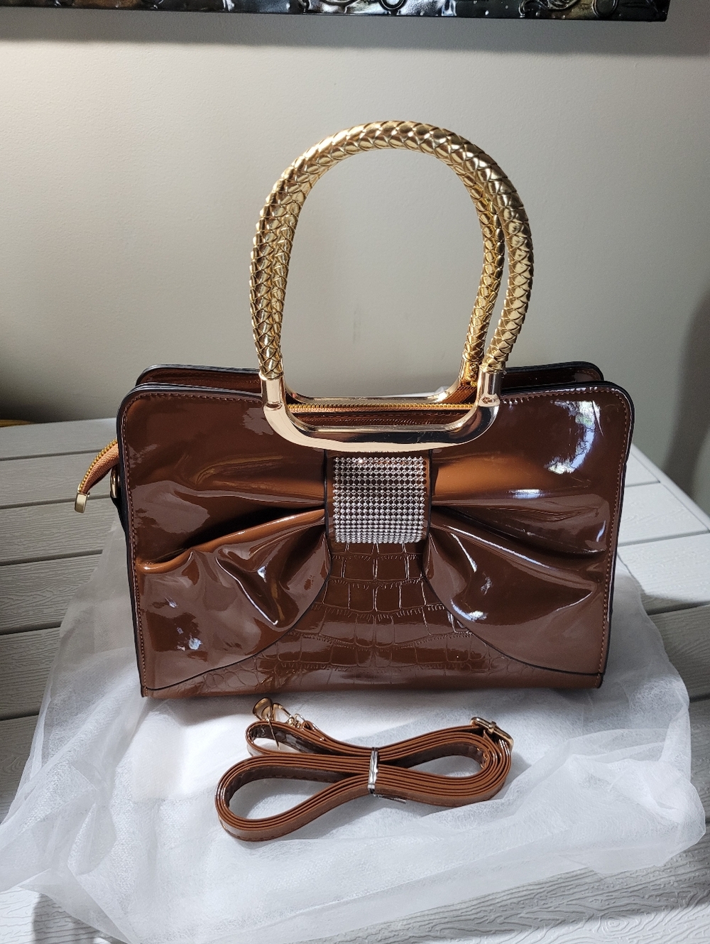 Patent Brown Satchel with Gold Braided Handles and Rhinestone Bow